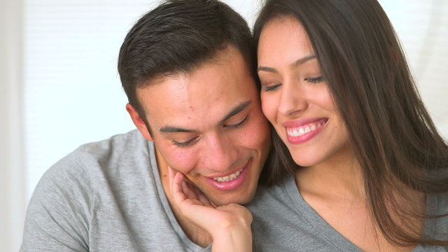 Happy Mexican couple smiling