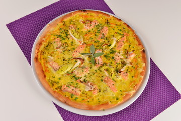 Delicious pizza with salmon and vegetables