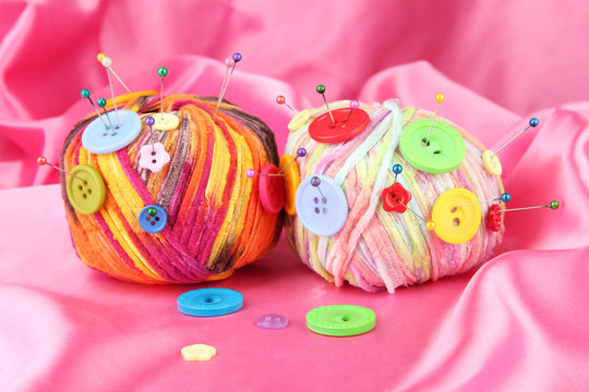 Colorful buttons and multicolor wool balls,