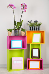 Beautiful colorful shelves with different home related objects