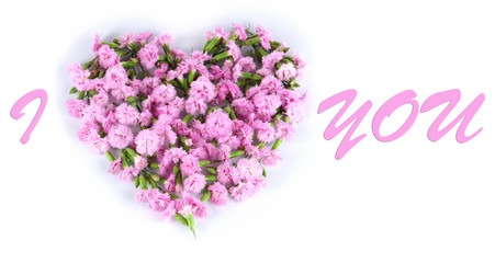 Obraz premium Flowers in the form of a heart isolated on white