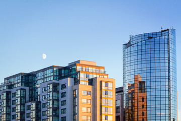 Modern boulding over blue sky with the moon in Ireland