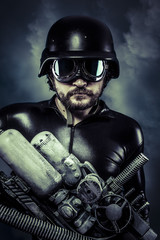 man of the future with huge laser cannon shotgun over cloudscape