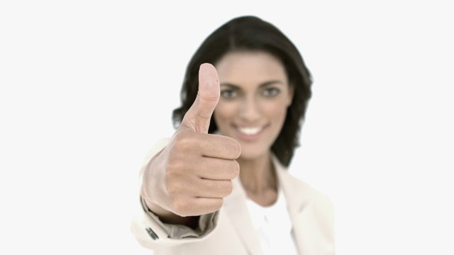 Businesswoman giving the thumbs up