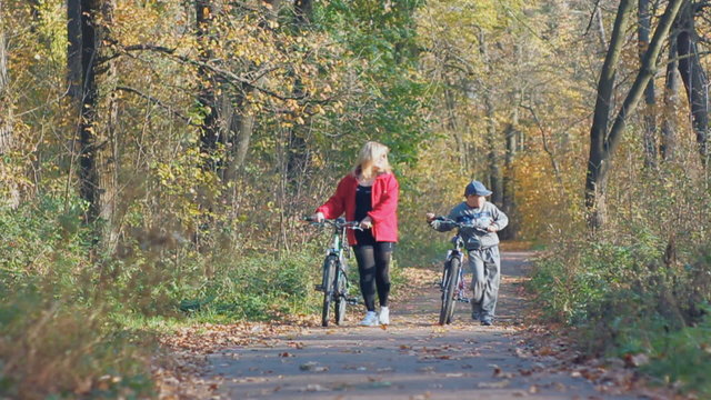 outdoor recreation. mother and son with bicycles