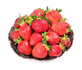 strawberries in metal bowl isolated on white background