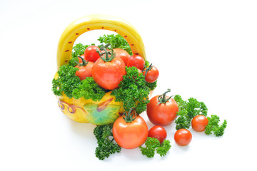 Fresh tomatoes and parsley isolated on white