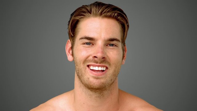 Man showing his happiness on grey background