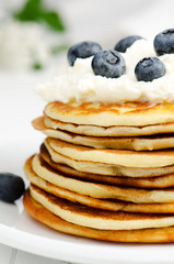 Small pancakes with blueberries, close up