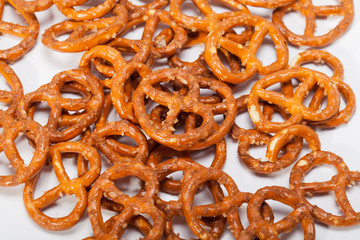 salted pretzels on white background
