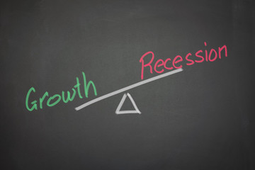 A drawing depicting the balance of growth and recession on a bla