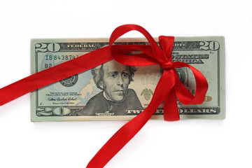 dollars tied with red ribbon isolated on white