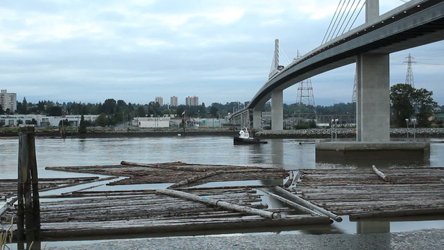 Tugboat. Logboom under Commuter Bridge Vancouver