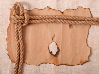 knot and old paper on the background of old cloth