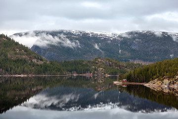 Norwegian landscape with calm sea and mountains