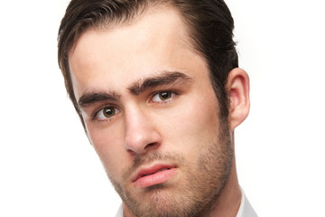 Portrait of a handsome young man isolated on white