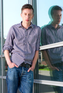 Young man standing alone outdoors