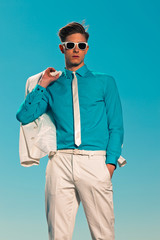 Retro fifties summer fashion man with white suit and sunglasses.