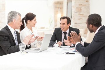Business People Applauding In a Meeting