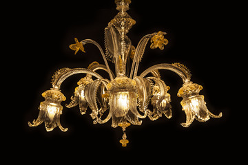 Beautiful chandelier(Murano Italy) isolated on black background.