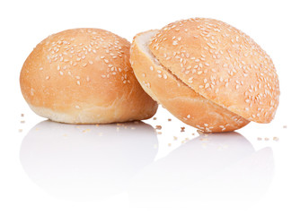Two sandwich bun with sesame seeds cut isolated on white backgro