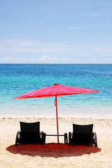 Beach chair and Red Umbrella on the beach