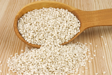 Sesame seeds in wooden spoon