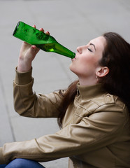 woman drinking beer from the bottle
