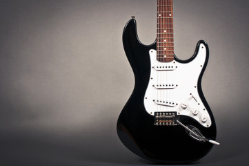 Electric guitar on grey background