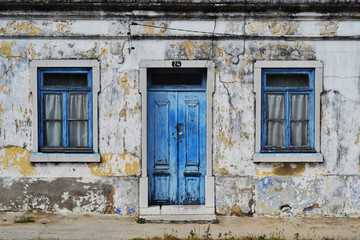 Fototapeta na wymiar Old house blue windows