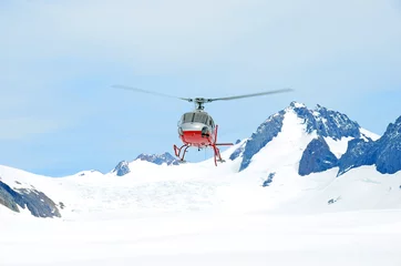 Fotobehang Helicopter taking off from the snow © hurleysb