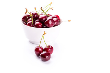 Sweet fresh cherry in a bowl isolated