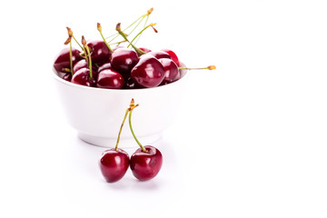 Sweet fresh cherry in a bowl isolated