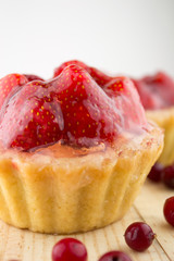 Cake with strawberries over white