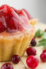 Cake with strawberries over white
