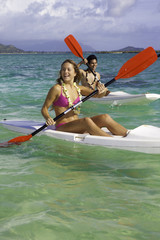 couple paddling surfskis