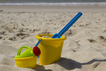 Fototapeta na wymiar Beach bucket and watering can