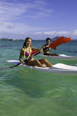 couple paddling surfskis