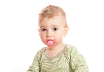Cute boy with a baby's dummy