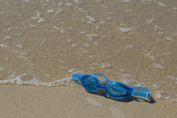 Swimming goggles wet with seawater