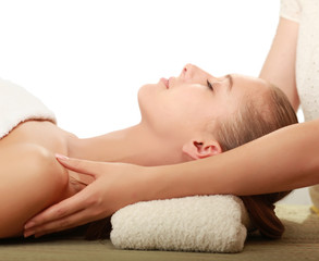 Obraz na płótnie Canvas An attractive young woman receiving massage