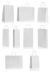 Various white paper shopping bags isolated