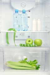 Open refrigerator with diet food