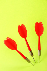 Darts on green background