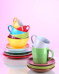 Mountain colorful dishes on pink background