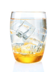 Glass with water and ice isolated on white