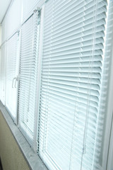 Obraz premium Balcony windows with shutters