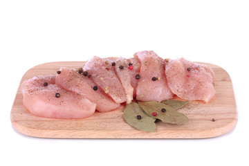 Chicken meat on board isolated on white