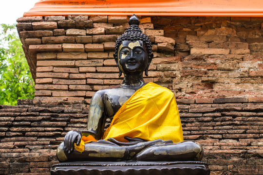 Black Buddha Statue and old chedi in Wat Lok mo lee , Chiangmai