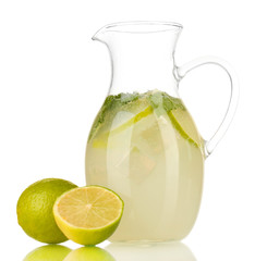 Lemonade in pitcher isolated on white